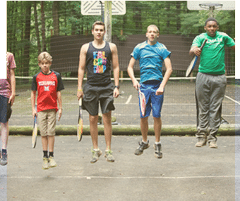 Young campers jumping