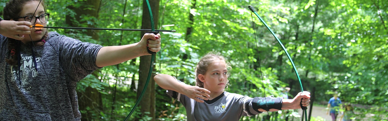 Campers learning archery