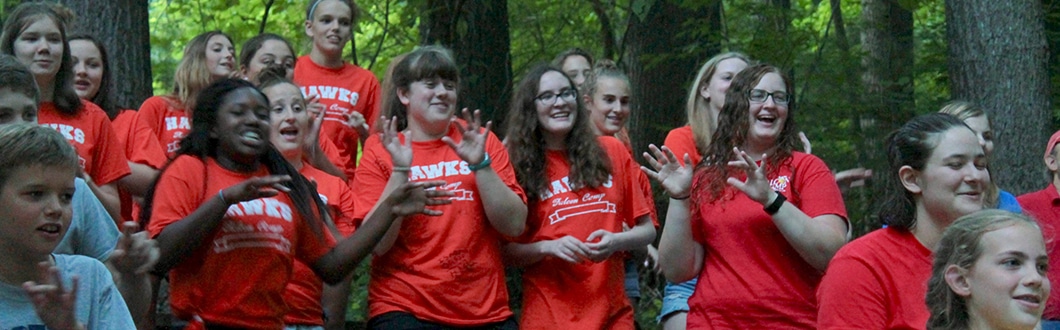 Campers singing and dancing