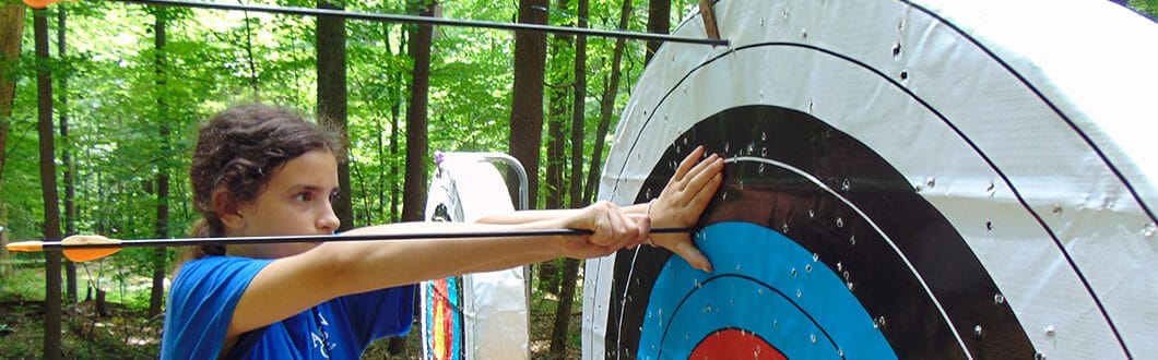 Camper learning archery