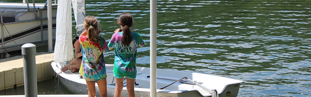 Young girls on the lake at summer camp