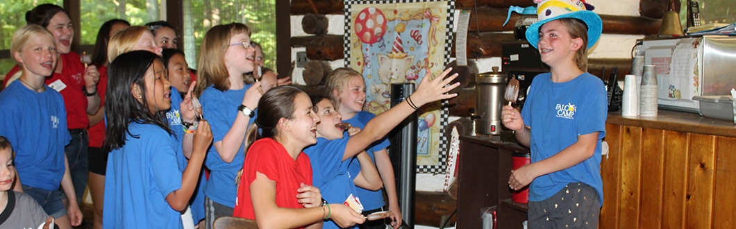 Campers having fun in the dining hall at summer camp