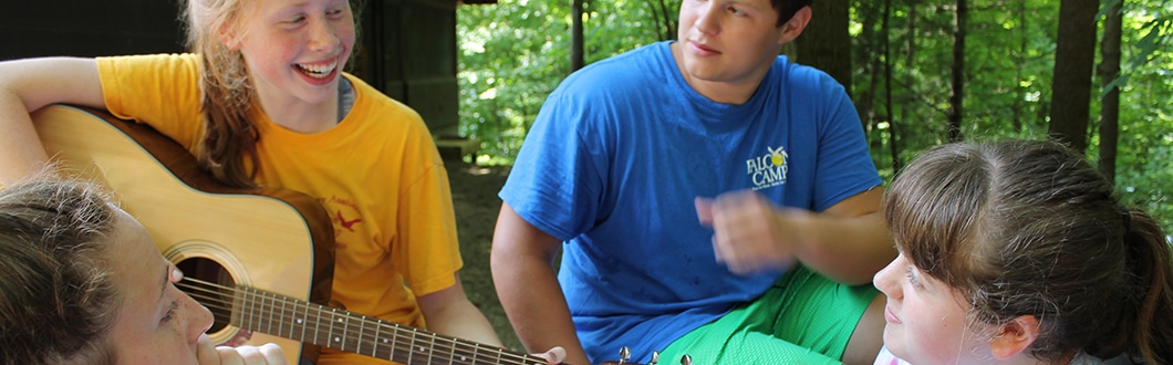 Campers playing guitar