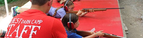 Learning riflery at summer camp