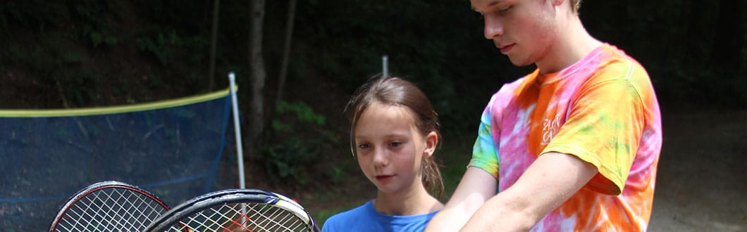 Learning tennis at summer camp