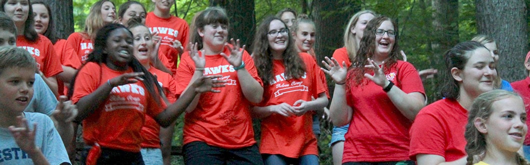 Campers singing and dancing at summer camp