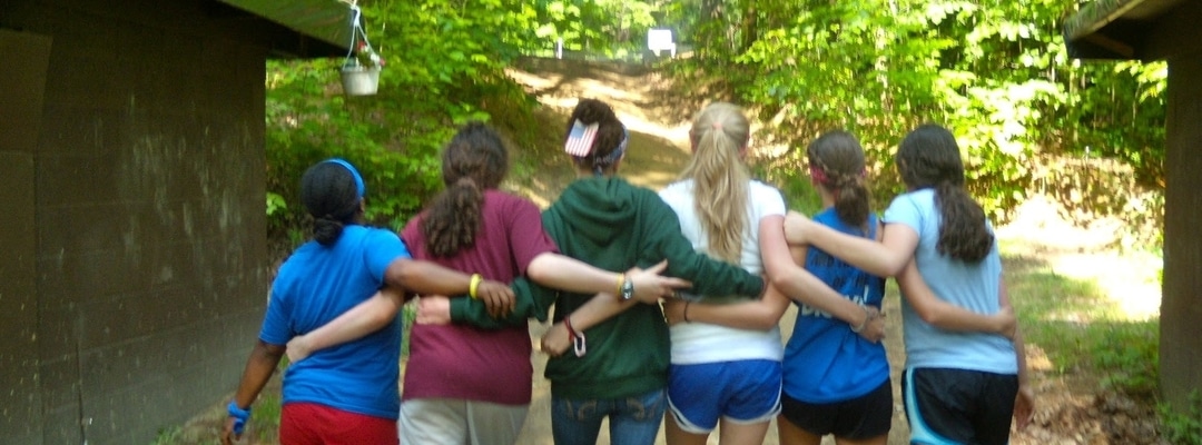 Girl campers walking together at summer camp