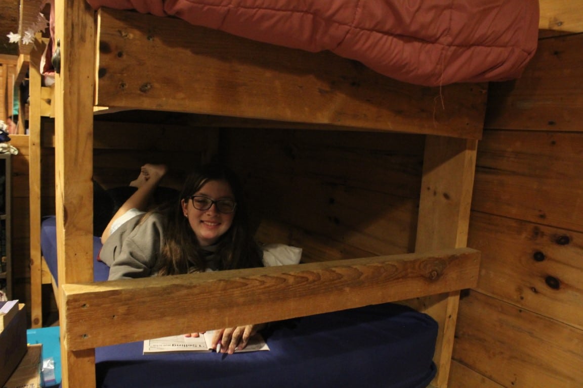 Camper on bunk in cabin